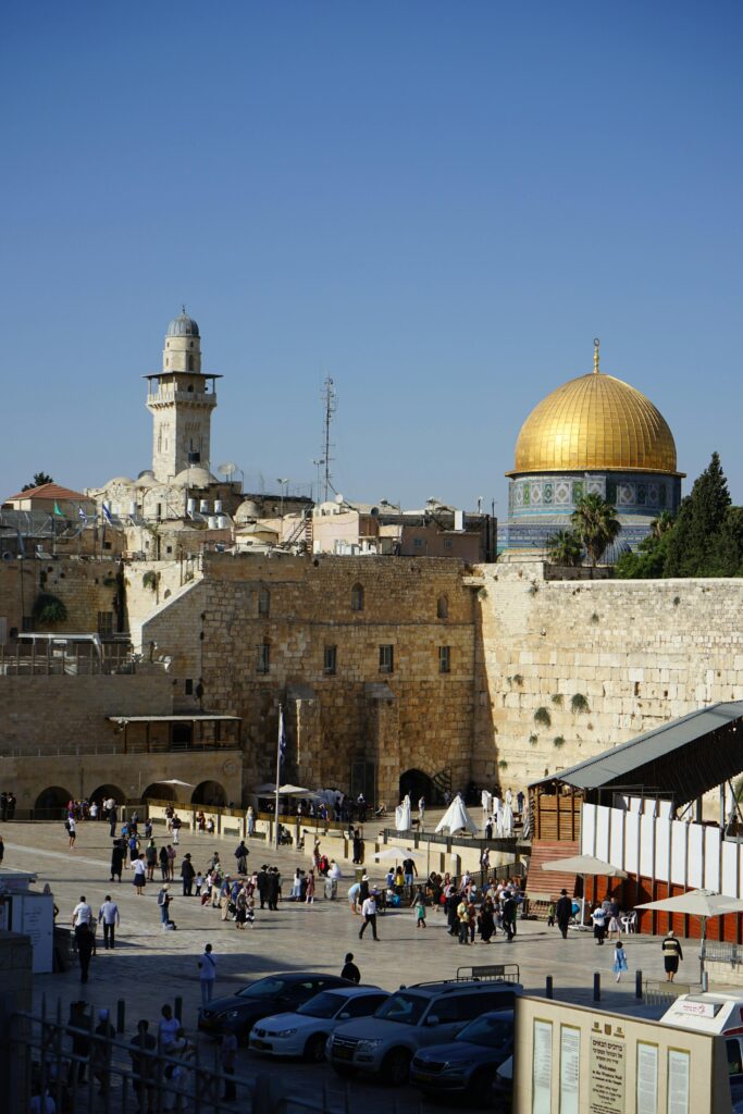People near Walls and Mosque